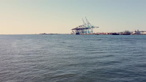 Harbour-Cranes-At-Container-Terminal-From-Gota-Alv-River-In-Gothenburg,-Sweden