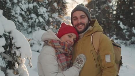 couple in winter forest