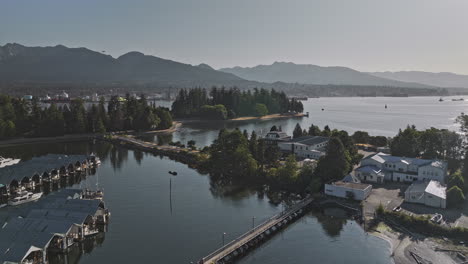 vancouver bc canada aerial v76 drone flyover stanley park capturing yacht club, north shore industrial site, mountains, and views of lions gate bridge - shot with mavic 3 pro cine - july 2023