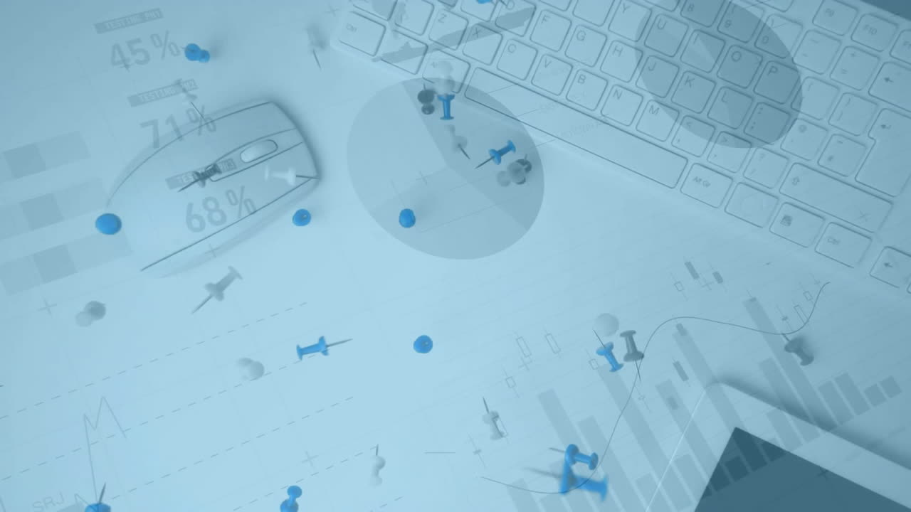 Keyboard with data charts and scattered pushpins creating animation on desk