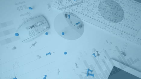 keyboard with data charts and scattered pushpins creating animation on desk
