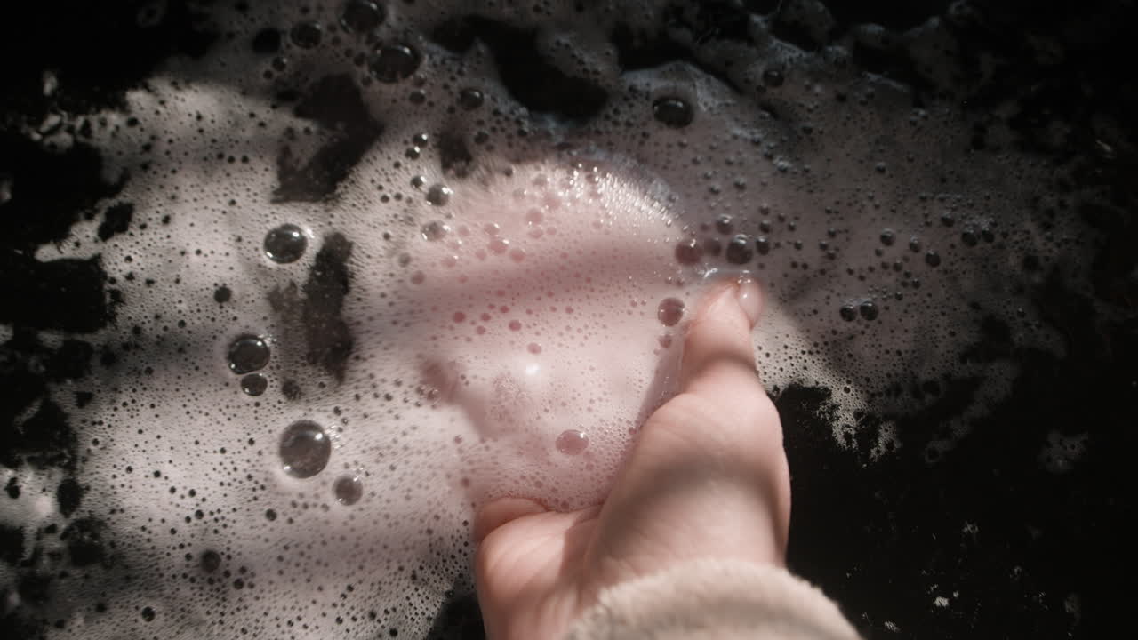 Pink Heart-Shaped Bath Bomb Dissolving in Bubbles