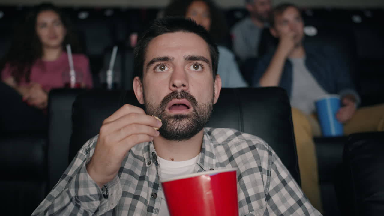 Man Watching a Movie at the Theater