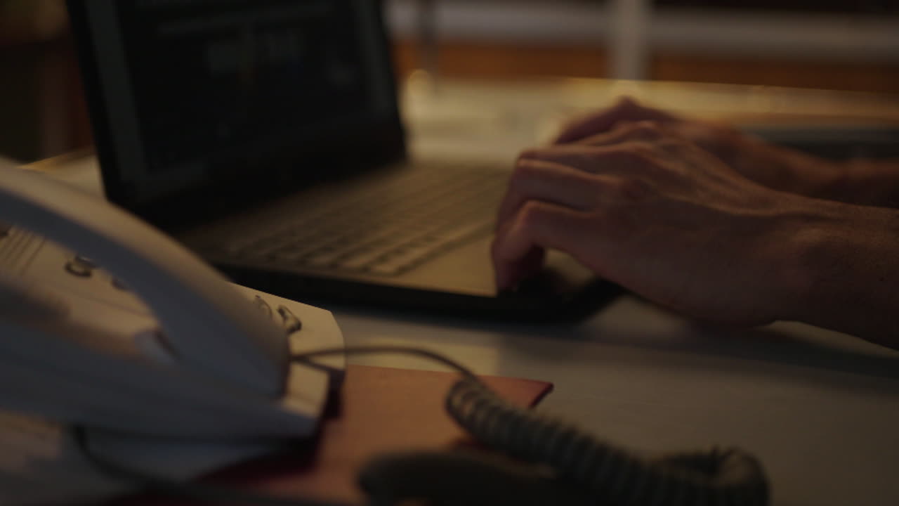 Person working at a desk at night