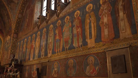 pan shot of frescoes on the interior walls of st