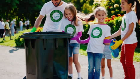 community service project: kids and adults cleaning up park
