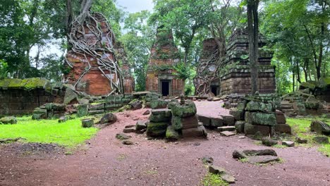 revealing shot of the lonely prasat kraham towers, historical and touristic site of cambodia