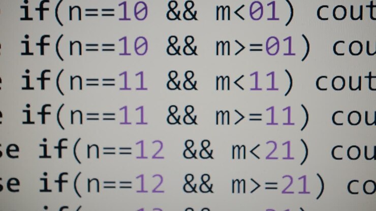 Source code on the monitor screen. Source code
