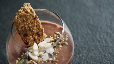 granola, dried fruits and chocolate mousse in glass 4k