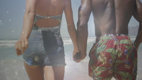 animation of happy african american couple holding hands at beach on sunny day over sea