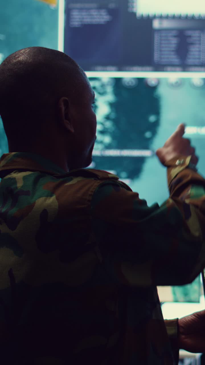 Military Soldiers Analyzing Strategic Data in a Command Center
