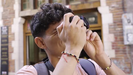 young hispanic tourist photographer taking architectural photos of brussels, belgium
