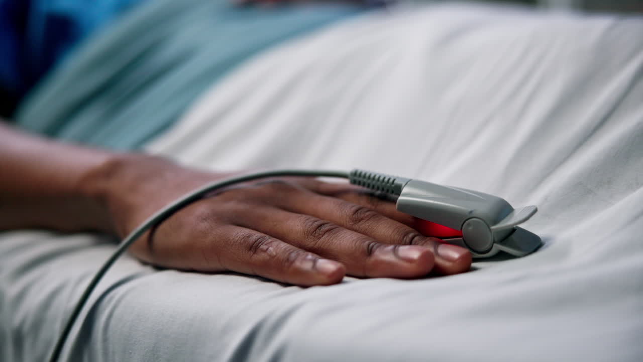 Pulse Oximeter on Patient's Hand