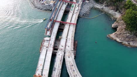 Hong-Kong-cross-bay-link-construction-project,-a-dual-two-lane-bridge-connecting-Tseung-Kwan-O-Lam-Tin-Tunnel-to-Wan-Po-Road,-Aerial-view