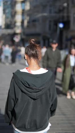 woman walking in city street