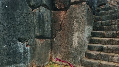 close up view of massive stone walls at sacsayhuamán, famous archaeological site in cusco, peru