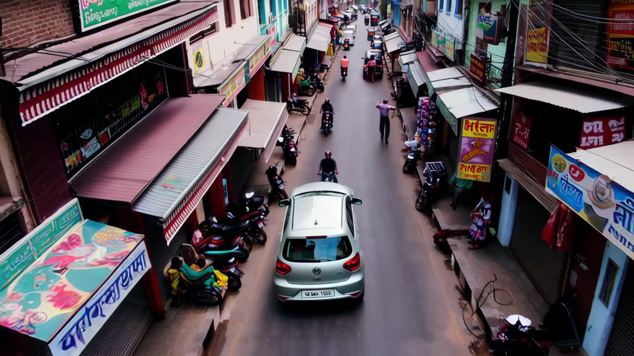 Busy Street Scene in an Asian City with Cars and Motorbikes