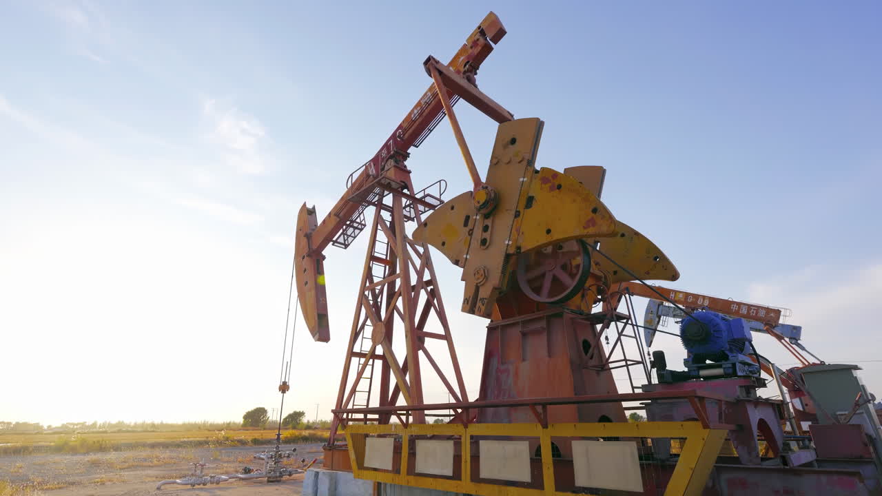 The change oil gasoline prices, petroleum crude oil drilling rigs derrick, pump jack machine oilfield work tirelessly, continuous extraction fossil fuels global energy consumption power supply crisis