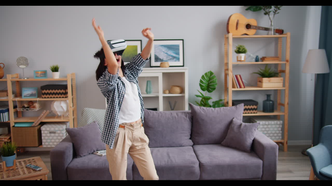 Woman Dancing in VR Headset at Home
