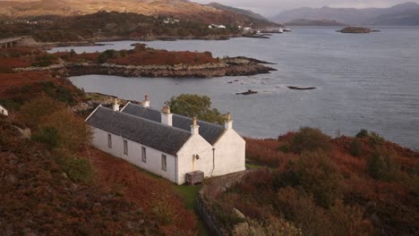 white cottage on beautiful islands on isle of skye, highlands of scotland