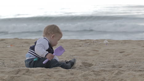 child playing with sand