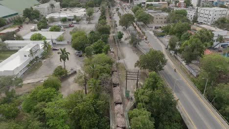 Cargo-train-passing-on-railway-bridge,-La-Romana-port-in-Dominican-Republic