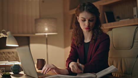 busy woman employee writing in copybook working on project late evening close up