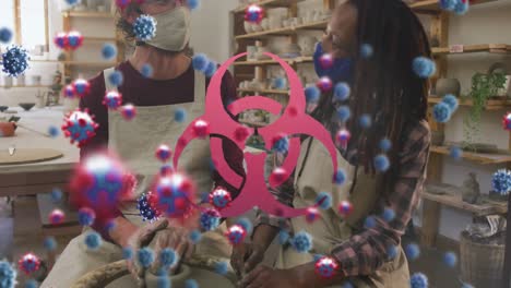animación de células de virus y símbolo de riesgo biológico sobre diversos trabajadores con máscaras faciales