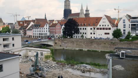 high angle wide shot of an demolition site by the river