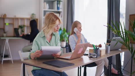 young corporate employee looking through documents