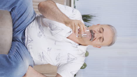 Vertical-video-of-Old-man-drinking-water-for-healthy-life.