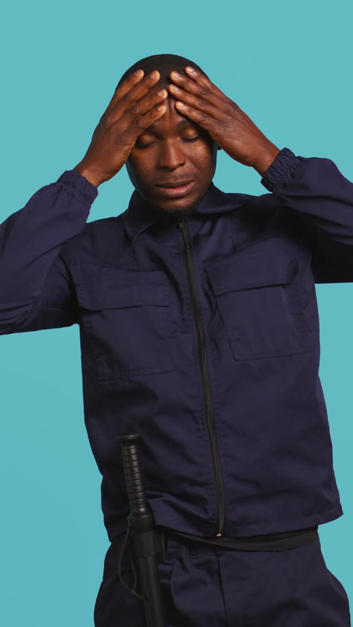 African American Security Guard Suffering from Headache and Stress