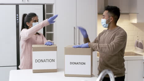 couple donating items in kitchen