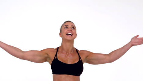 female athlete raising arms