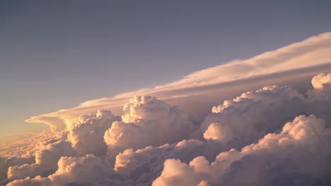 stunning cloudscape at sunset/sunrise from airplane window