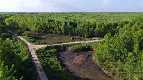 an irrigation pump station situated along a path in a lush green forest, highlighting agriculture in nature