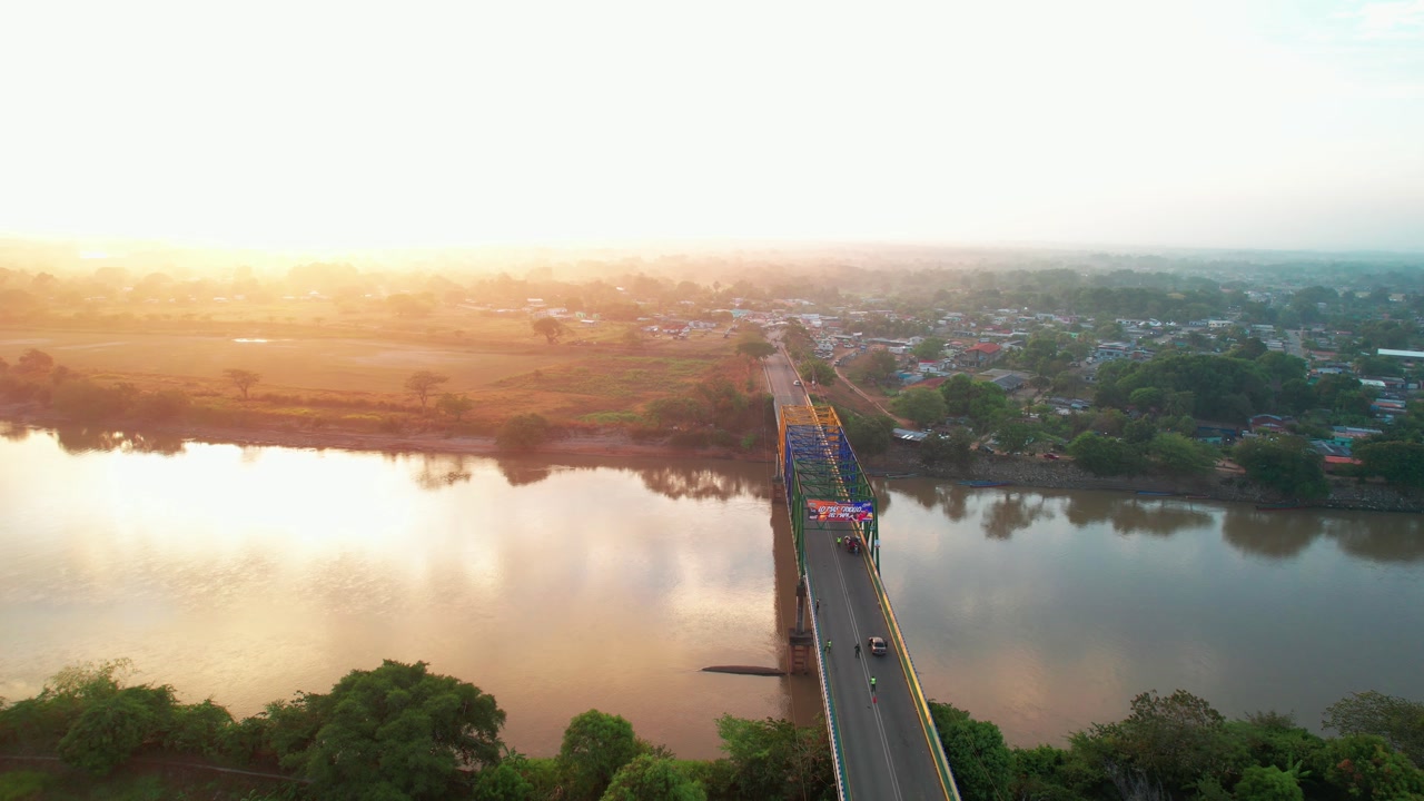 sunrise sunshine over colorful Lauro Carrillo Bridge , Arauca River, Apure Venezuela