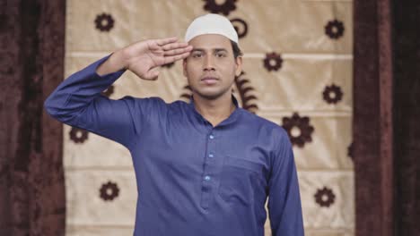 indian muslim man saluting to the camera