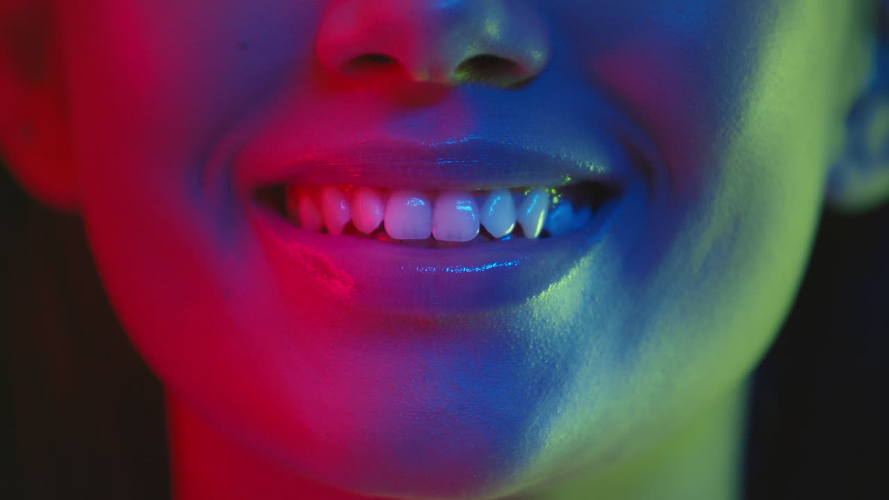Close-up Neon Portrait of a Smiling Woman