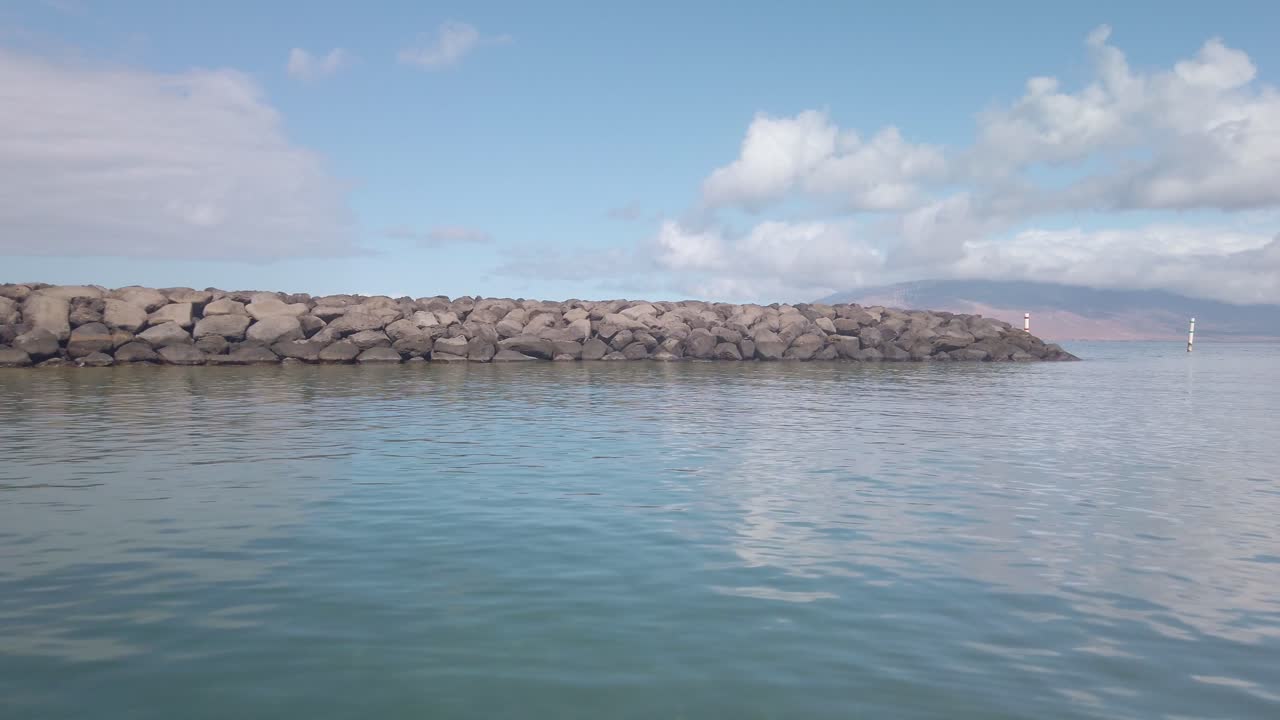 Gimbal POV shot from a moving boat leaving the Kihei Boat Landing in South Maui, Hawai'i