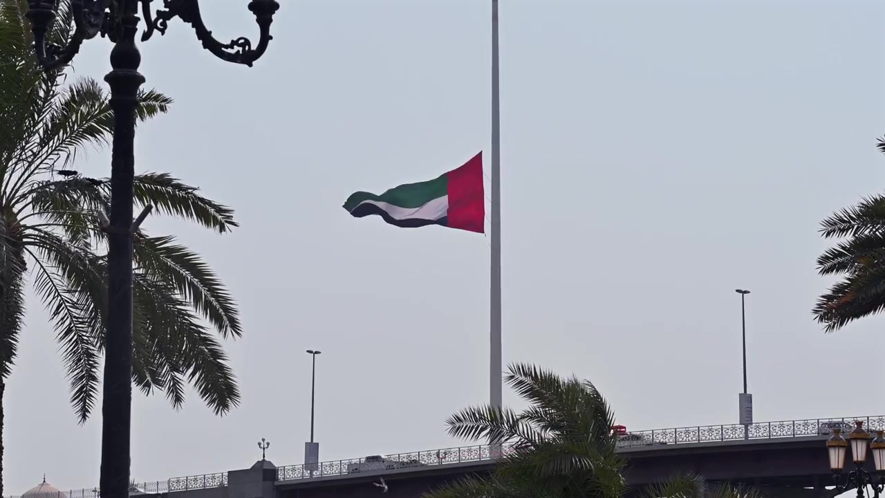 The UAE flag flying at half-mast during a period of national mourning.