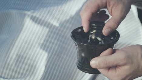 shaving cream in ceramic cup. shaving brush. beard grooming