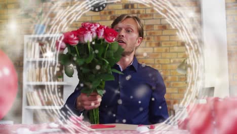 Animation-Von-Lichtpunkten-Und-Kreisen-über-Einem-Kaukasischen-Mann,-Der-Rosen-Hält