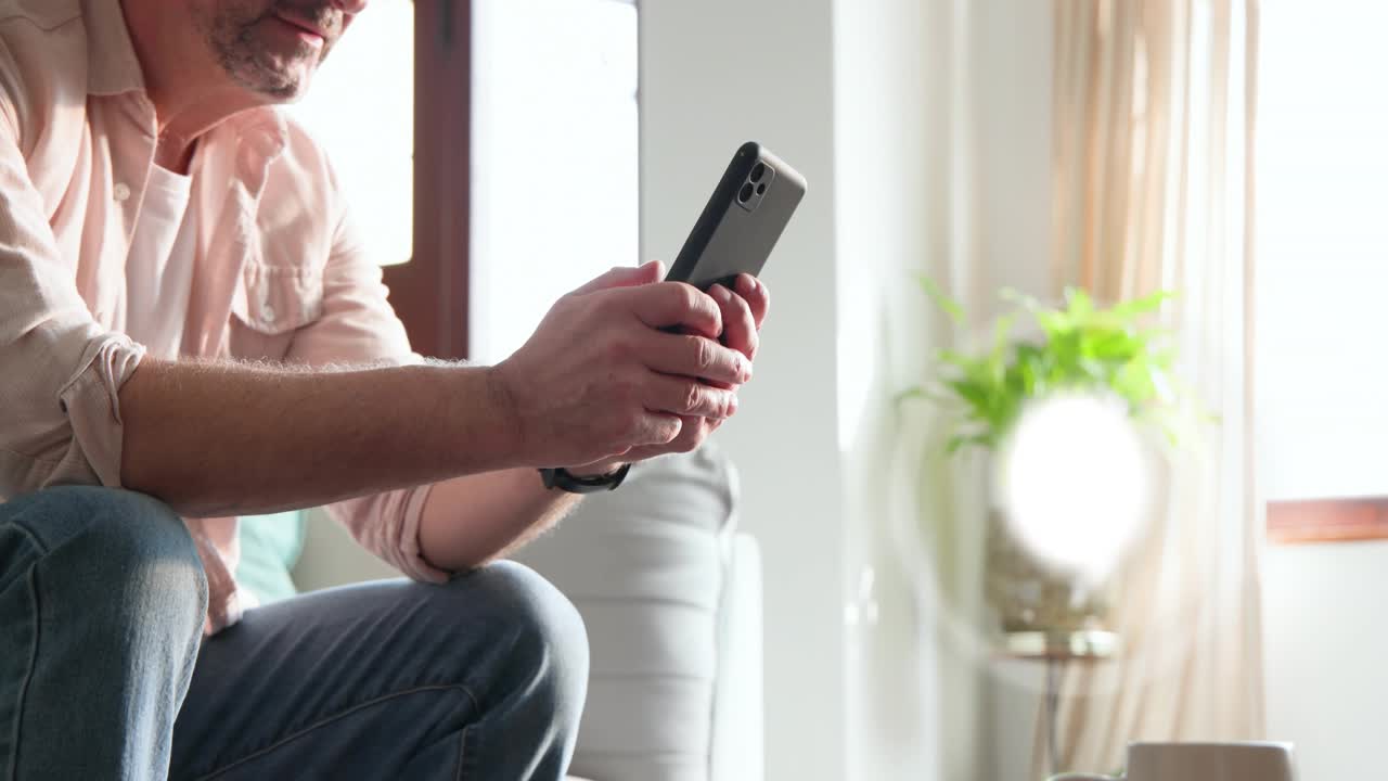 Man lifting mug and glancing phone while UI tech icons appearing, checking alerts, tapping, swiping
