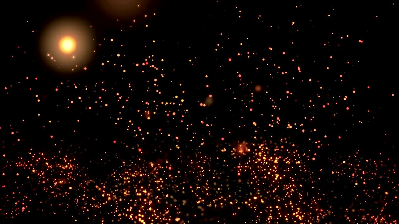 Golden confetti bokeh lights on the black background