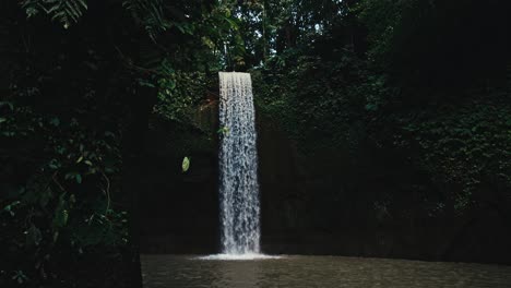 a remote and isolated waterfall in a tropical forest in bali