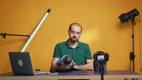 vlogger holding video light