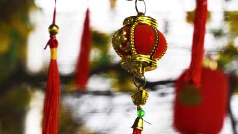 close up of asian lantern ornament hanging from ceiling of establishment