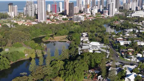 aerial animation of a drone flying over a lush park with a city skyline, showcasing vibrant greenery and urban architecture