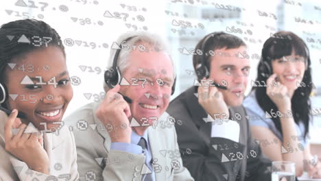 animation of financial data processing over happy diverse business people using headsets